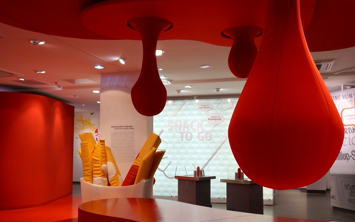 Giant sized ketchup drops inside the Currywurst Museum as one of the many quirky design elements in Berlin, Germany