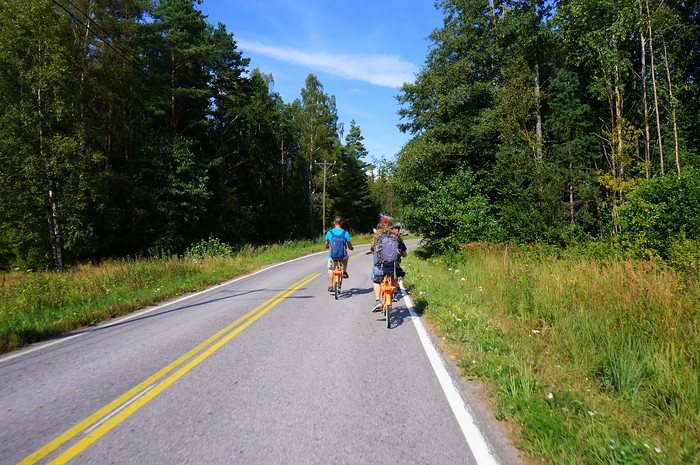 Going on a biking tour of Hanko's local farms in Finland cycling on the side of the road