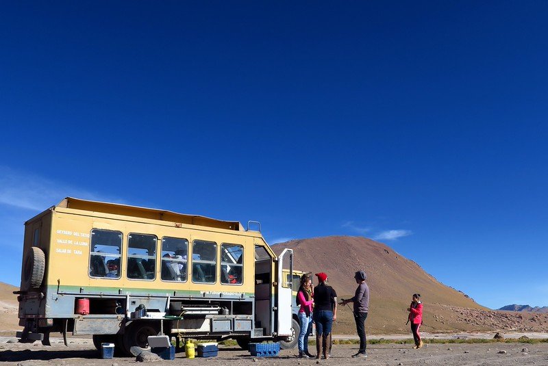 Tour truck with Grado 10 Tours parked in the Atacama Desert, Chile, during an early morning excursion to the El Tatio Geysers