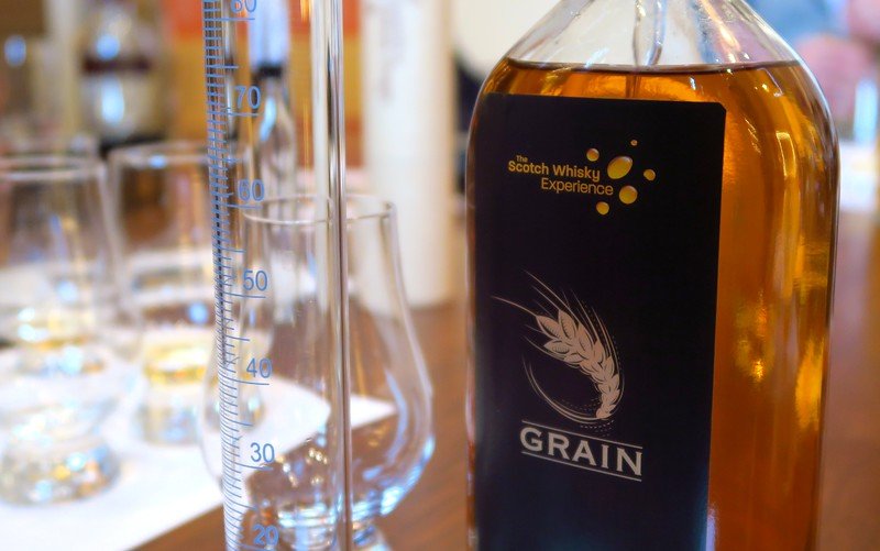 Grain whisky bottle and tasting glasses during blending session at the Scotch Whisky Experience in Edinburgh, Scotland