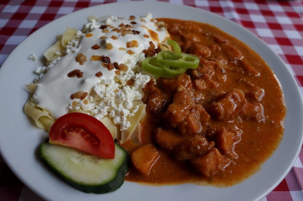 Gulyás or Goulash is a traditional food to try in Hungary that is a hearty meal that is popular with locals and tourists alike