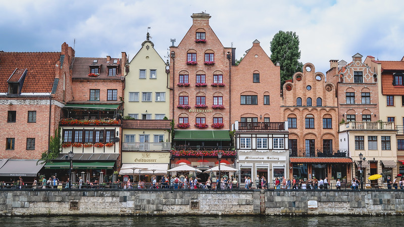 Hanseatic buildings along the waterfront in Gdansk with their distinct tall and narrow appearance and stylish windows in Poland