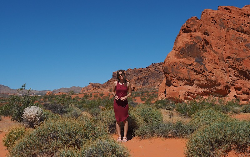 Happy to have taken a day trip to Valley of Fire because the landscapes are magical with That Backpacker Audrey Bergner posing with camera in hand Happy to have taken a day trip to Valley of Fire because the landscapes are magical with That Backpacker Audrey Bergner posing with camera in hand