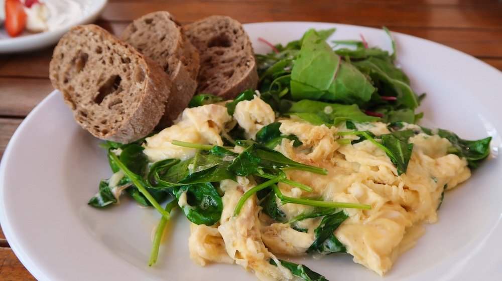 Healthy eggs, spinach and toast for breakfast in Bratislava, Slovakia Healthy eggs, spinach and toast for breakfast in Bratislava, Slovakia