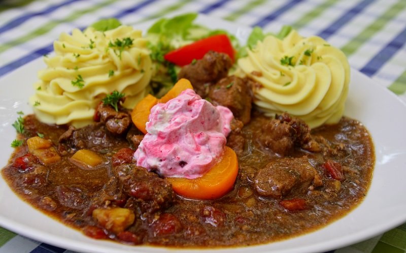 Hearty and delicious meal served in Spreewald, Germany eating traditional German cuisine in the enchanted forest Hearty and delicious meal served in Spreewald, Germany eating traditional German cuisine in the enchanted forest