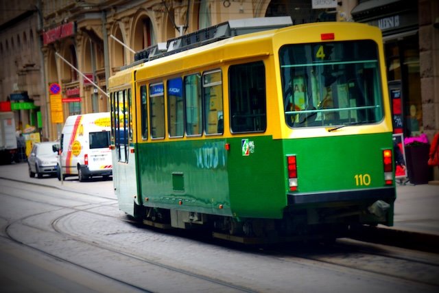 Green and yellow tram number 4 in Helsinki, Finland, showcasing the city’s iconic public transportation system. These trams are a convenient way for visitors staying at Hotel Katajanokka to explore attractions, markets, and historic landmarks around the city
