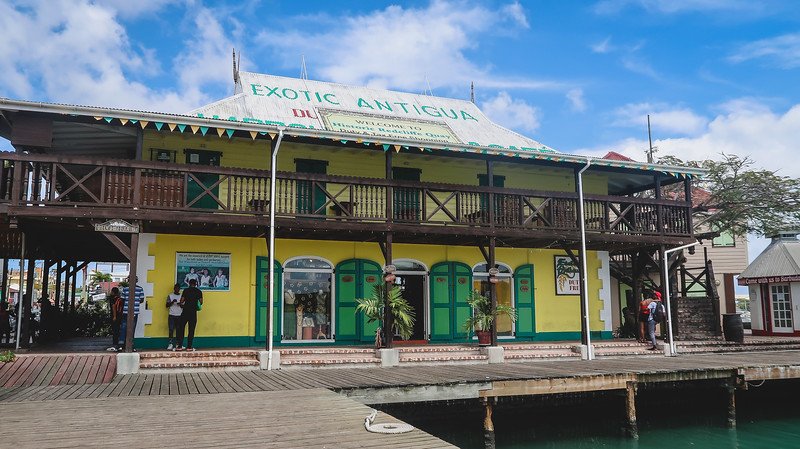 Heritage Quay colorful yellow boardwalk in St. John's in Antigua Heritage Quay colorful yellow boardwalk in St. John's in Antigua