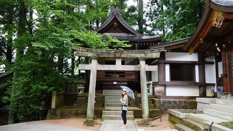 Hiking the Higashiyama Walking Course in Takayama, Japan visiting temples and shrines is That Backpacker Audrey Bergner with umbrella in hand