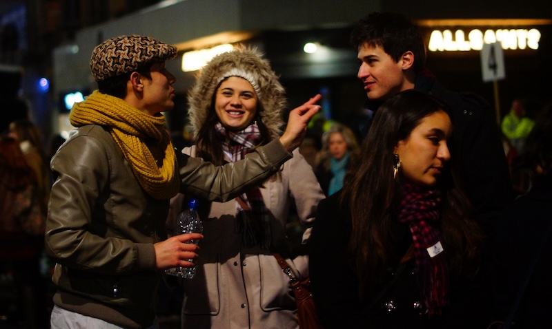 Hogmanay legendary street crowds conversations in Edinburgh, Scotland