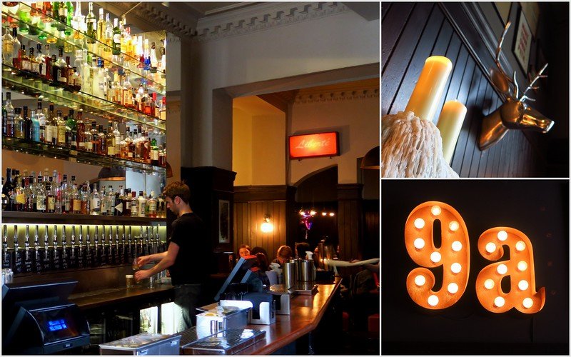 Interior of Holyrood 9A pub in Edinburgh, Scotland with bartender pouring drinks, shelves of spirits, warm lighting, and decorative details