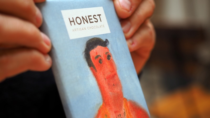 Honest artisanal chocolate being held in the hand in Stellenbosch, South Africa Honest artisanal chocolate being held in the hand in Stellenbosch, South Africa