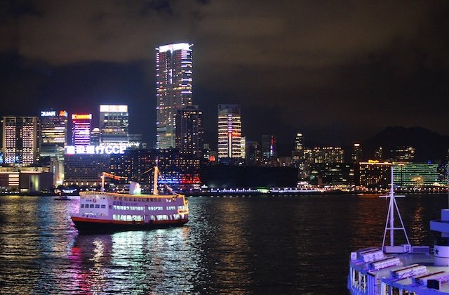 Hong Kong ferry crossing at night from Kowloon to Hong Kong Island 
