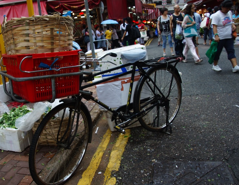 Hong Kong local bicycle parked in a crowded market 