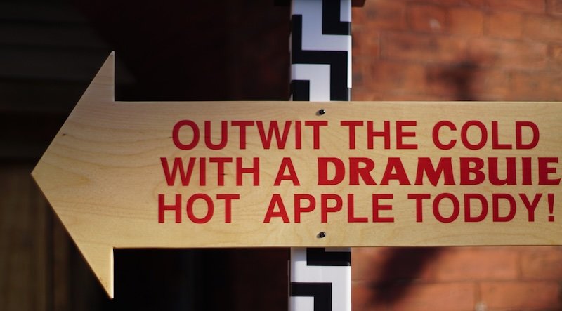 Hot Apple Toddy Out With The Cold sign at the Toronto Christmas Market 