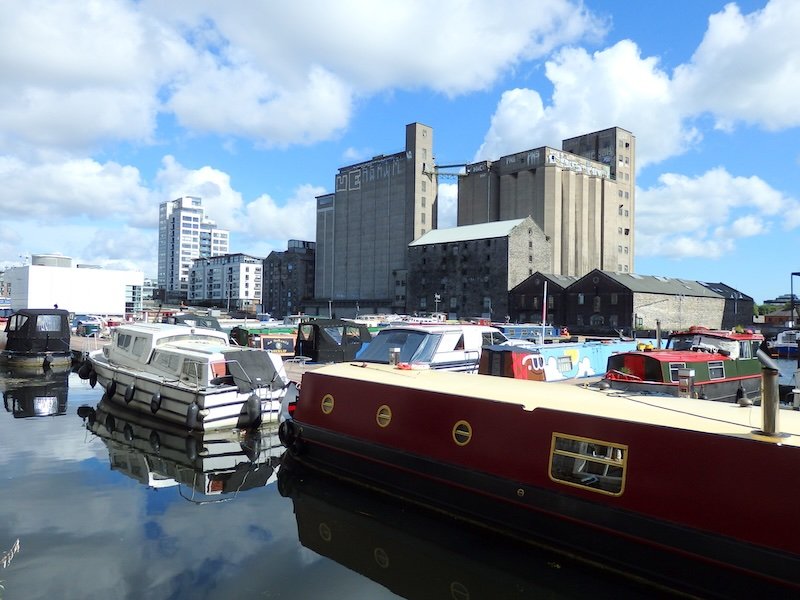 House boats, tourist boats and fishing boats docked in Dublin, Ireland on a bright sunny day 