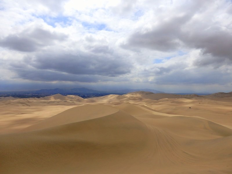 Huacachina desert with moody clouds in Peru 