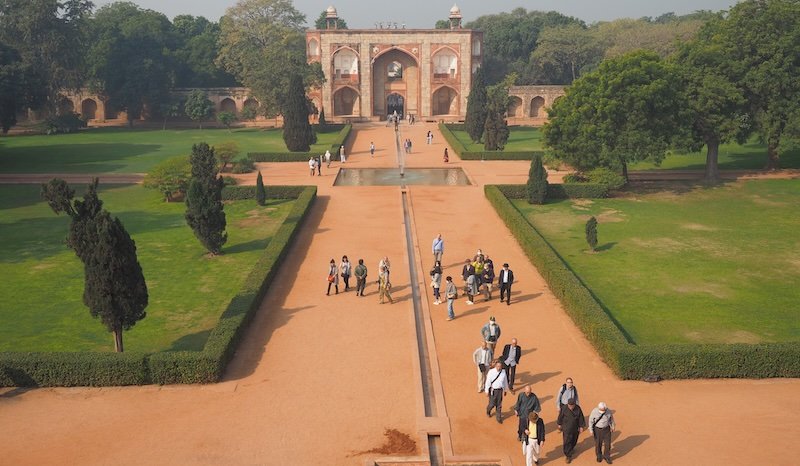 View from Humayun’s Tomb overlooking the Charbagh garden and main gateway in Delhi, India, highlighting Mughal architecture and Persian-inspired landscaping