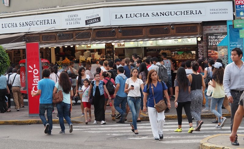 Hustle and bustle busy intersection crossing in Miraflores, Lima, Peru 