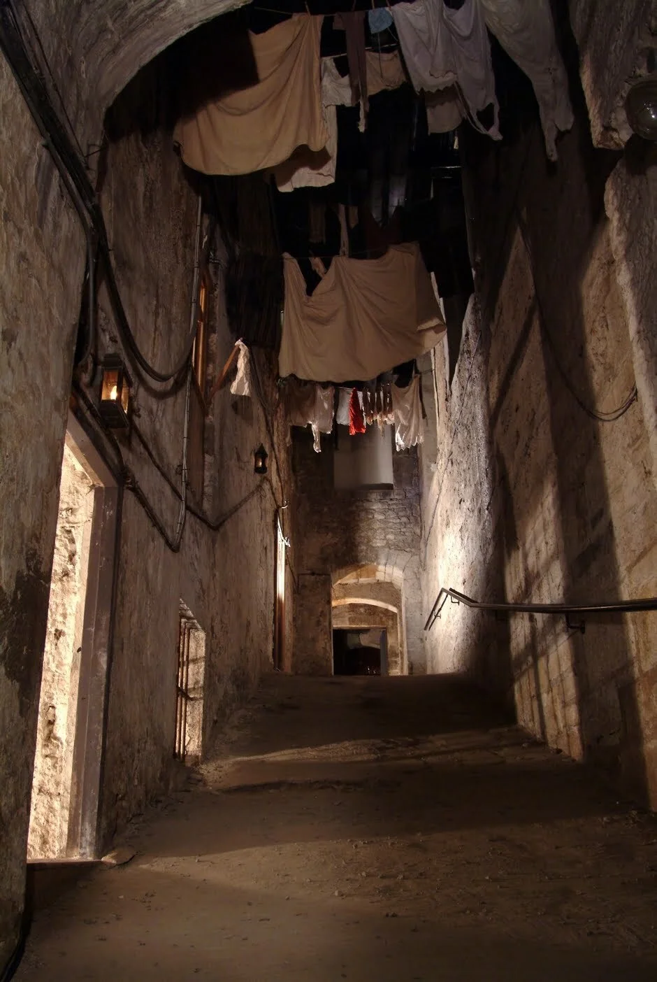 Inside Mary King's Close. Images c/o Mary King's Close. Laundry hanging from balconies in the alleyways in Edinburgh, Scotland