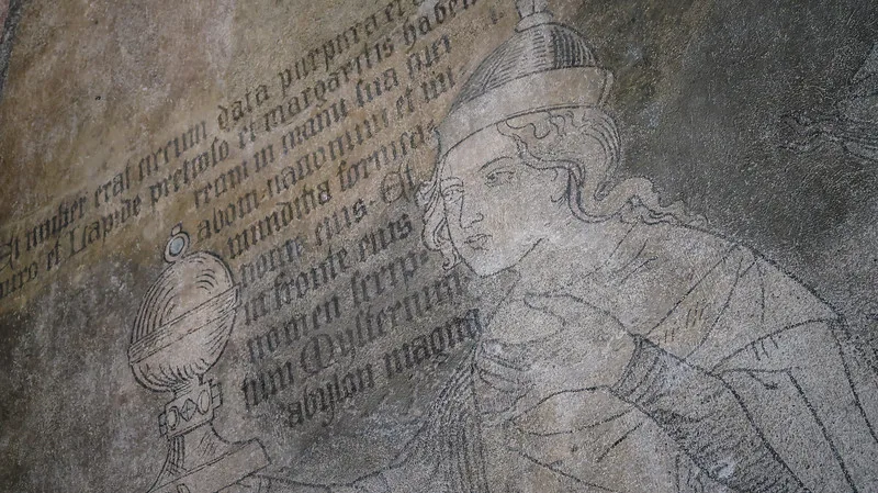 Inside the Malbork Castle Museum distinct wall mural with painting and text in Poland