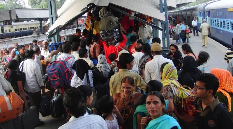 Intense and crazy train station scene in India as passengers exit the train and go up the staircase exit ramp Intense and crazy train station scene in India as passengers exit the train and go up the staircase exit ramp
