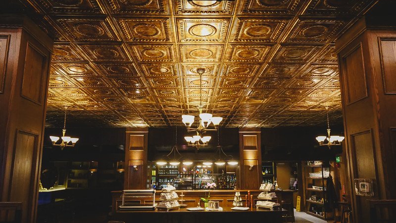 Interior decor at The Arms Public House in Halifax, Nova Scotia, Canada with a golden touch on the ceiling 