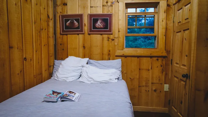 Interior of the the off-grid cabin viewing the bedroom side Interior of the the off-grid cabin viewing the bedroom side