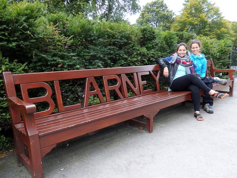 Ireland road trip in Blarney posing by the park bench 