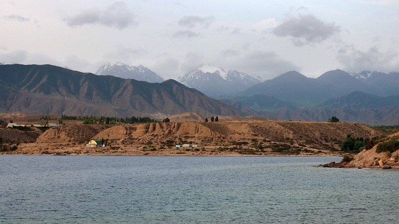 Issyk Kul Lake and mountains in the background offering a slice of serenity and nature beauty in Kyrgyzstan