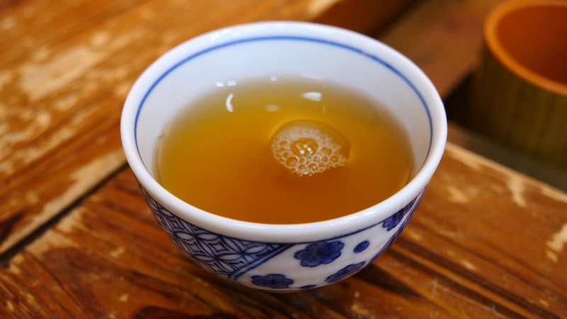 Japanese hot tea in a traditional tea cup in Takayama, Japan Japanese hot tea in a traditional tea cup in Takayama, Japan