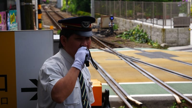 Japanese train conductor on a day trip fro Tokyo, Japan Japanese train conductor on a day trip fro Tokyo, Japan