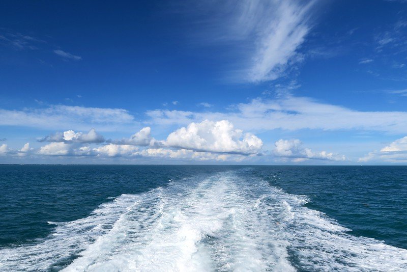 John Pennekamp Coral Reef State Park views from the back of the boat with nothing but water views and beautiful sky with clouds 