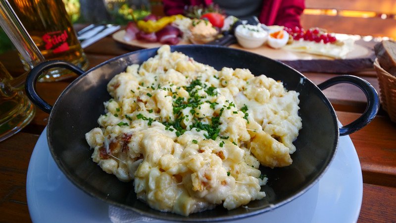 Kasnocken is an Austrian noodle dish fried in a pan with cheese and the ultimate comfort food after a day of hiking in Gaisberg, Austria 