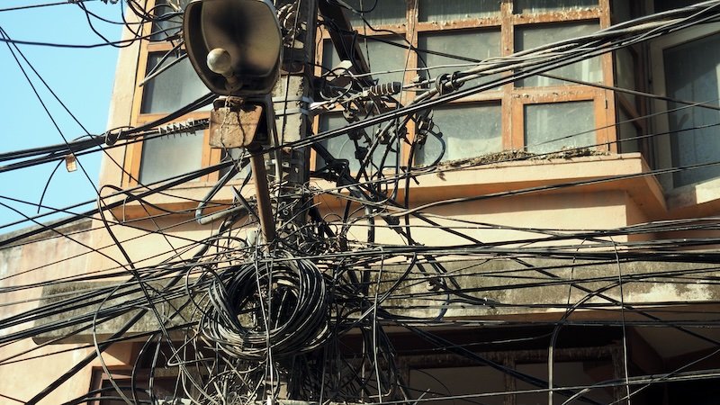 Tangled electrical wires and utility cables in Kathmandu, Nepal, a common sight reflecting the city’s chaotic yet fascinating urban infrastructure