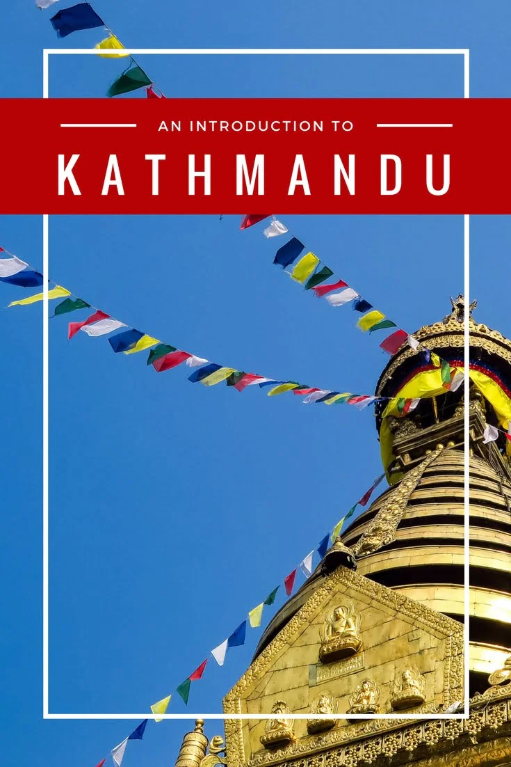 Colorful prayer flags draped across the golden stupa at Swayambhunath in Kathmandu, Nepal with bold red title graphic reading Kathmandu Travel Guide