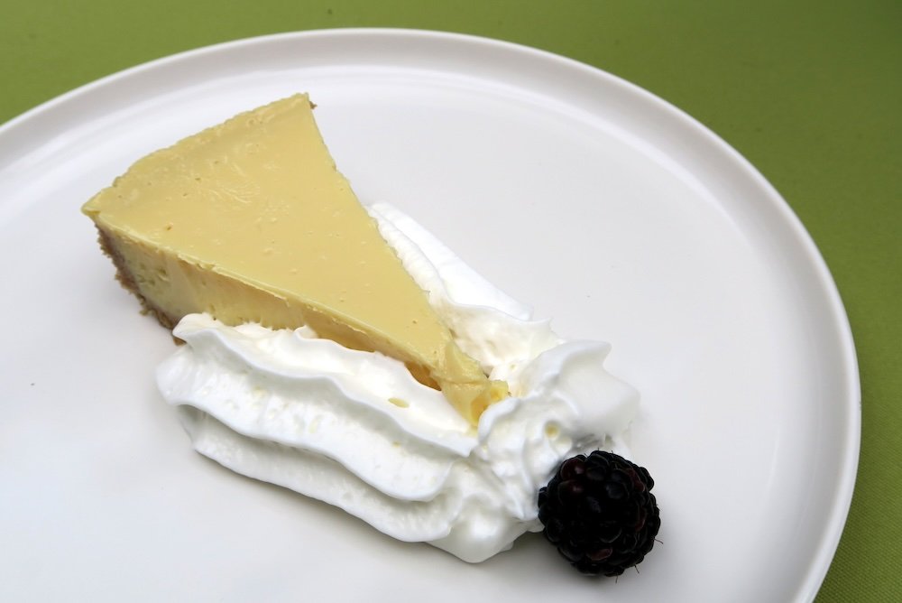 Key Lime Pie with a moat of cream and berry 