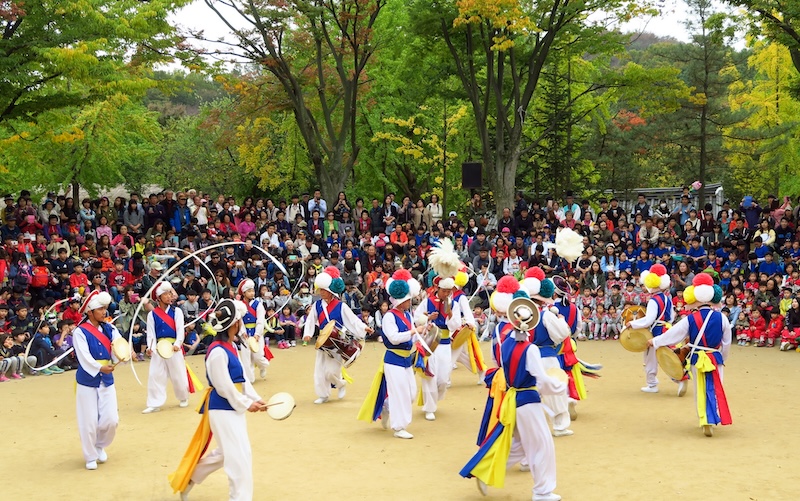 Korean Folk Dance win drums, ribbons and colorful outfits at the Korean Folk Village in Suwon, Korea 