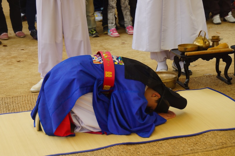 Korean groom bowing during the wedding ceremony at the Korean Folk Village in Suwon, Korea 