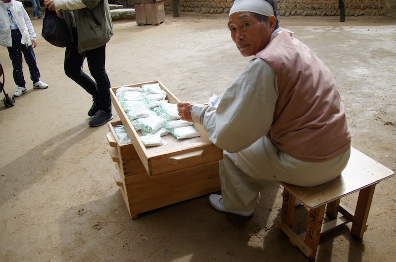 Korean man selling traditional Korean snacks at the Korean Folk Village in Yongin, Korea 