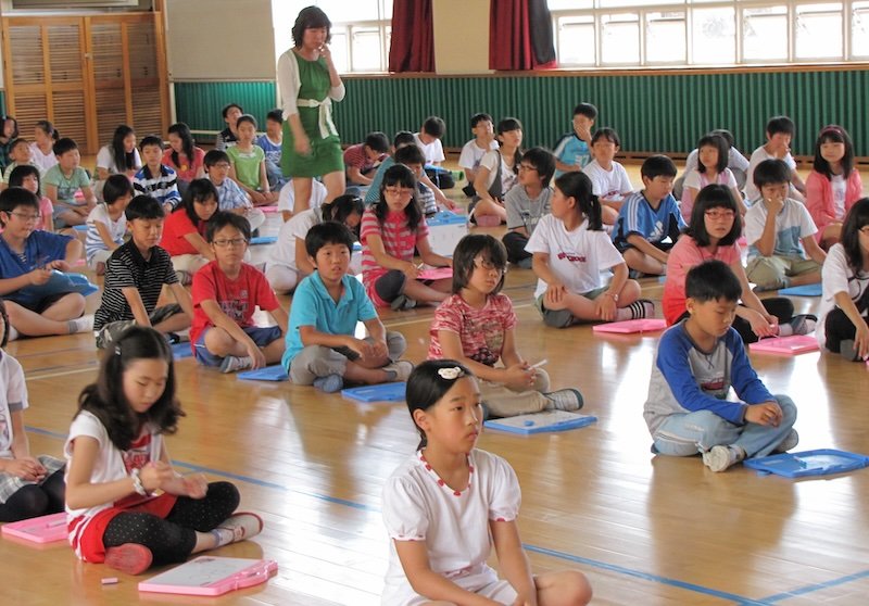 Korean students gathered at the gym to learn English together Korean students gathered at the gym to learn English together