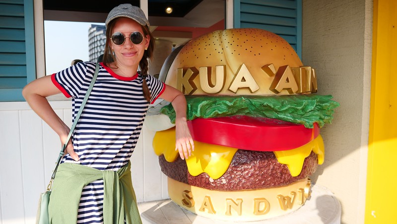 KUA'AINA serves some delicious Hawaiian burgers in Odaiba with That Backpacker Audrey Bergner posing beside it KUA'AINA serves some delicious Hawaiian burgers in Odaiba with That Backpacker Audrey Bergner posing beside it