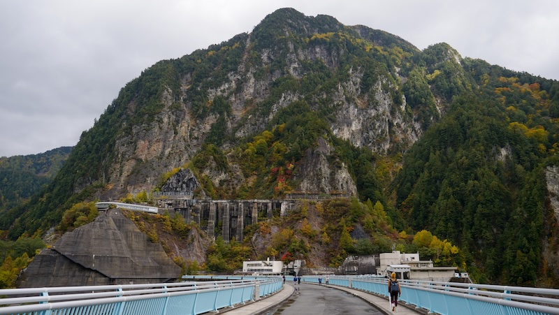 Kurobe Dam views with That Backpacker Audrey Bergner walking in the distance in Japan 
