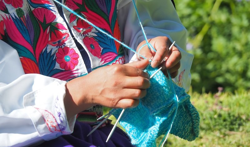 Lake Titicaca local lady knitting macro derails in Peru 