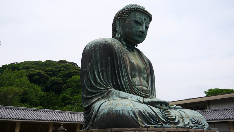 Large Buddha statue at Kotoku-in Temple in Kamakura from a unique vantage point in Japan Large Buddha statue at Kotoku-in Temple in Kamakura from a unique vantage point in Japan