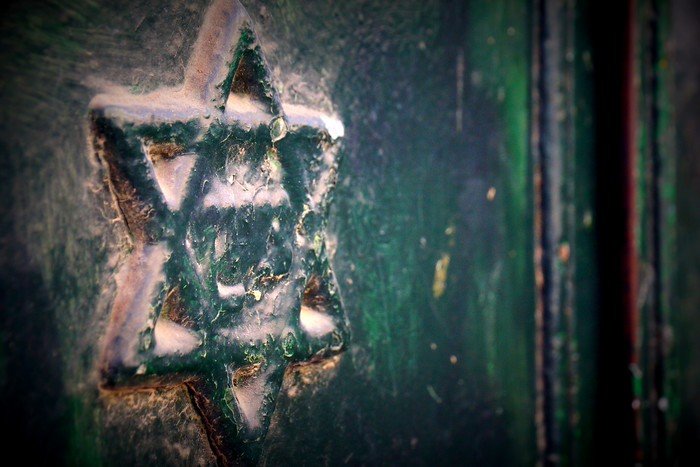 Learning about the Orthodox Jews in Jerusalem with an emblematic sign outside of the door