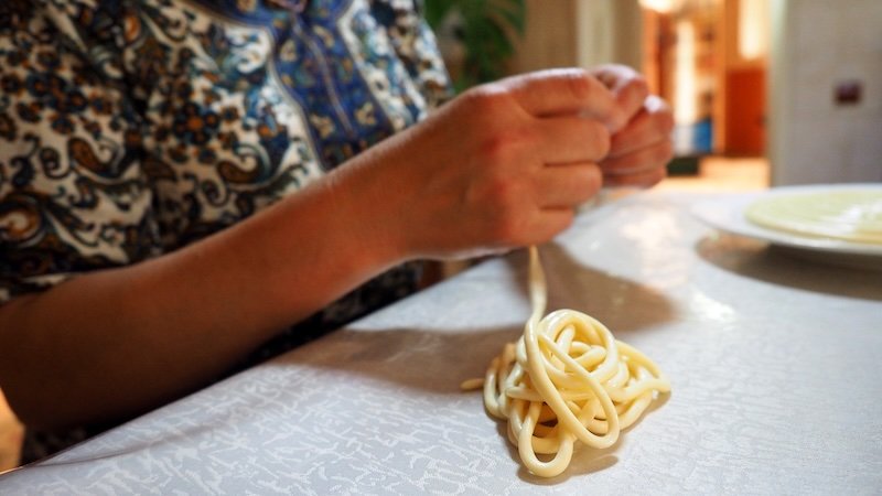 Learning to make noodles by hand at a cooking class in Karakol, Kyrgyzstan 