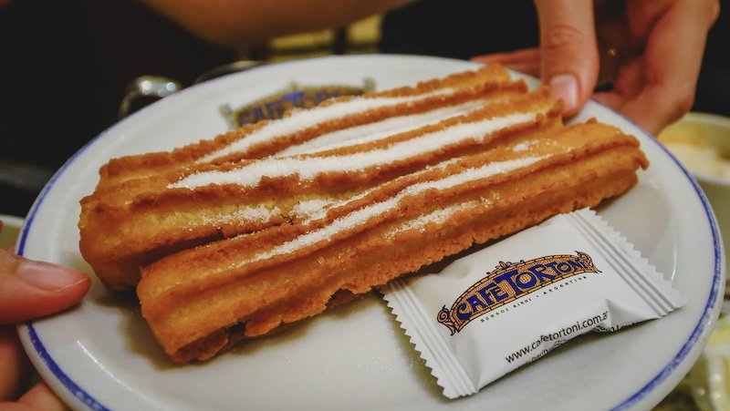 Legendary churros dusted with sugar at the iconic cafe Tortoni in Buenos Aires 