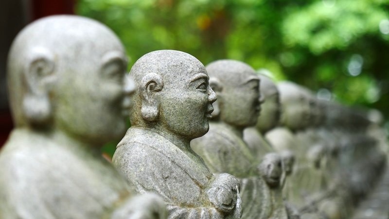 Lined up Buddha select focus bokeh at Mount Takao, Japan 