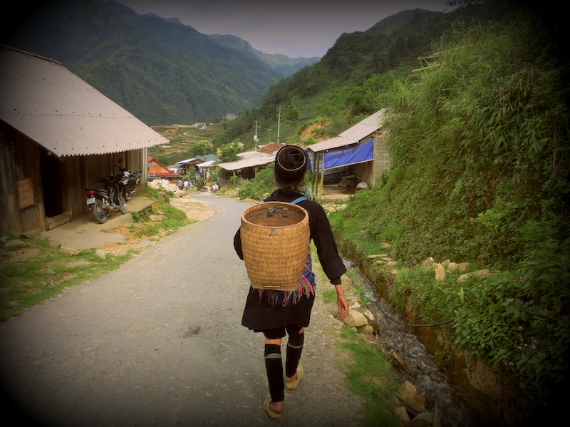 Local hiking Hmong guides in Sapa, Vietnam wandering down the hill 