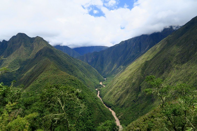 Looking out into the Valley on our Inca trail hike in Peru with stunning wilderness and raw beauty and grand scale on offer